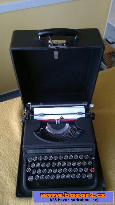 Kufříkový psací stroj Olivetti