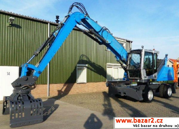 Fuchs 320 prekladaci 20t  83kW, r.v. 2007, barva